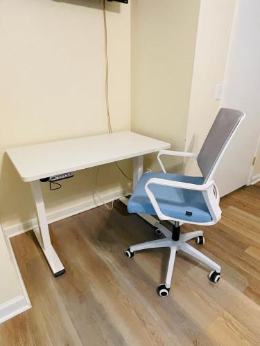 a desk with a blue chair and a white desk at 13 Beach Stop Hilton Head in Hilton Head Island