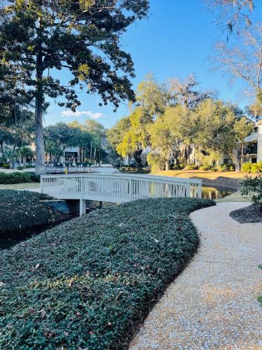 a white bridge over a pond in a park at 13 Beach Stop Hilton Head in Hilton Head Island