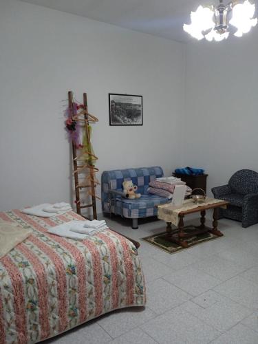 En eller flere senge i et værelse på B&B La casa dell'ospite