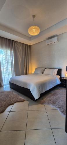 a bedroom with a large bed in a room at Villa Al Firdaous in Tiznit