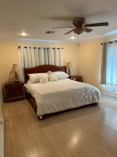 a bedroom with a bed and a ceiling fan at New Orleans Ponderosa in New Orleans