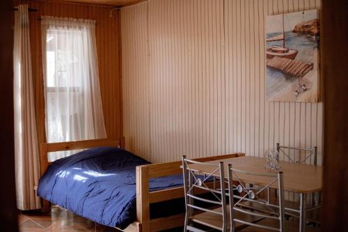 Postel nebo postele na pokoji v ubytování Cabañas en Dichato frente a la playa