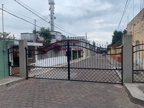 a black gate with a slide on it at La Aurora Hotel Like Home in Huamantla
