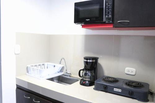 Kuchyň nebo kuchyňský kout v ubytování Atriz apartaestudios, 204 , Norte de la ciudad , cerca Av de los estudiantes