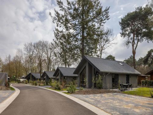 a row of houses on the side of a road at Eco Villa in Latour with Garden Sauna in Oirschot