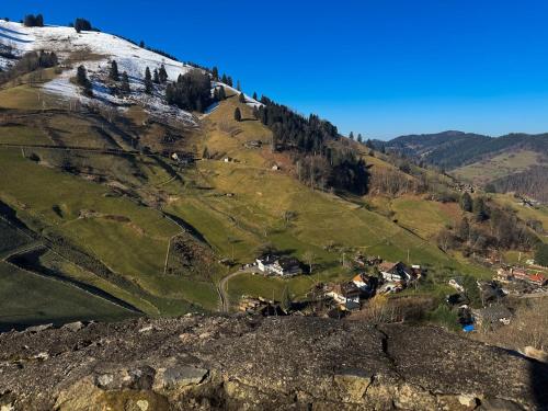 an aerial view of a mountain with a village on it at Traumurlaub in Sicht! 77qm Familiendomizil in Münstertal
