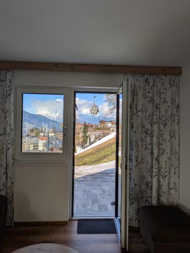 an open door with a view of a mountain at Apartment Bergland in Sankt Johann im Pongau
