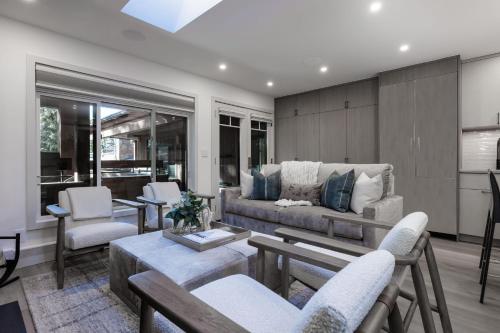a living room with a couch and chairs at 2 BR 3BA Condo - AC, Heated Pool, Walk to Town in Aspen