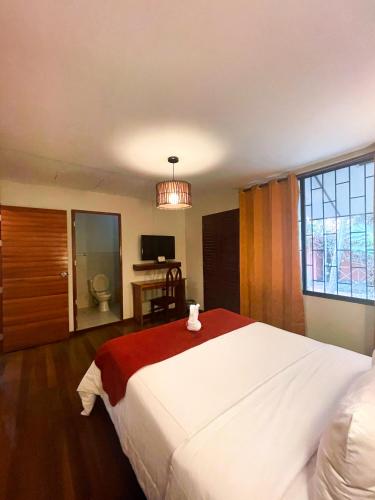 Una cama o camas en una habitación de Manish Hotel Ecólogico