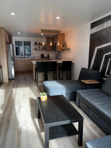 a living room with a couch and a table at Old Sunny Hills in Fullerton in Fullerton