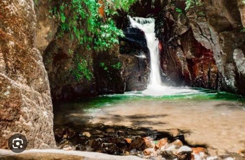 a waterfall in the middle of a river at Studio Tibiscus - Riviere Salée in Médecin