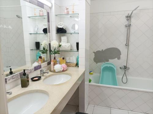 a bathroom with two sinks and a shower at Marreiro's house Algarve - Child friendy - Private Pool in Lagos