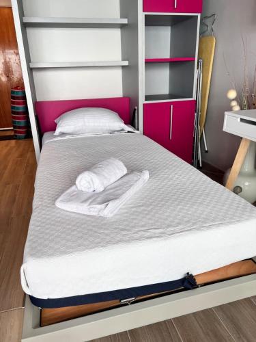a bed with two towels on it in a bedroom at Studio at the heart of Carre D'or 2 mins Sea Wi-fi in Nice