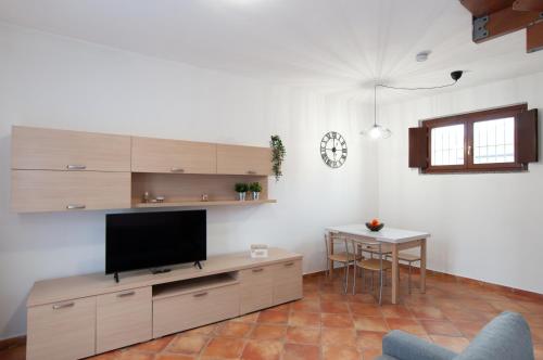 Televisyen dan/atau pusat hiburan di Sole Luna Homes - Appartamenti in Corte