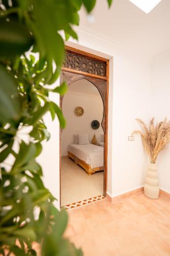 a bedroom with a bed and a large mirror at Dasofinya lodges in Touggana
