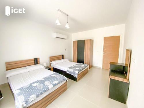 Ένα ή περισσότερα κρεβάτια σε δωμάτιο στο Canal studio in marassi marina exm19