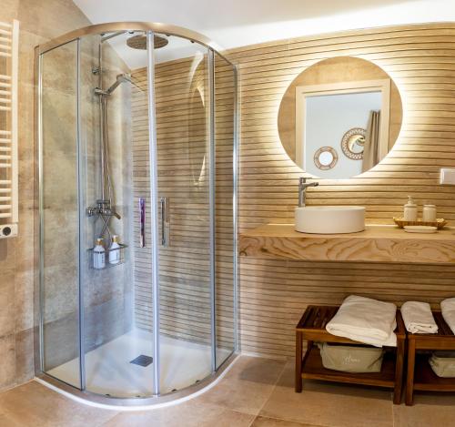 a bathroom with a shower and a sink at Apartamentos Canterías in Cáceres