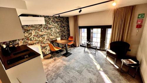 a living room with a table and chairs at Casa Española in Ath