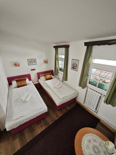 an overhead view of a bedroom with two beds at Guesthouse Yildiz in Sarajevo