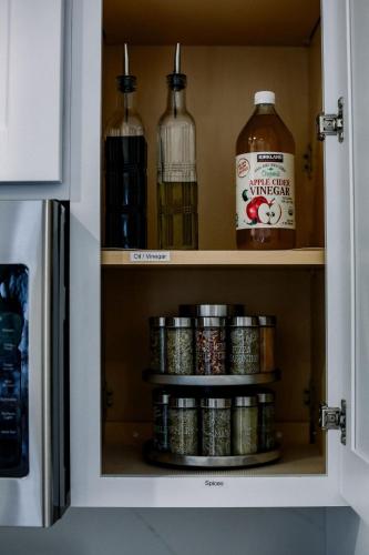 a cupboard with alcohol bottles and cans in it at Tranquil Mountain Retreat in Santa Cruz in Santa Cruz