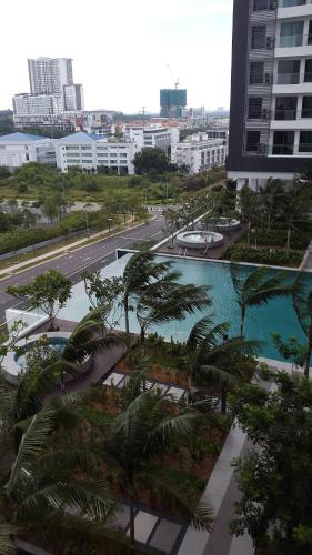 arial view of a city with a pool and palm trees at Spectacular Suite in the heart of Cyberjaya in Cyberjaya