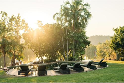 a group of chairs sitting around a fountain in a park at El Questro - The Homestead in Kununurra
