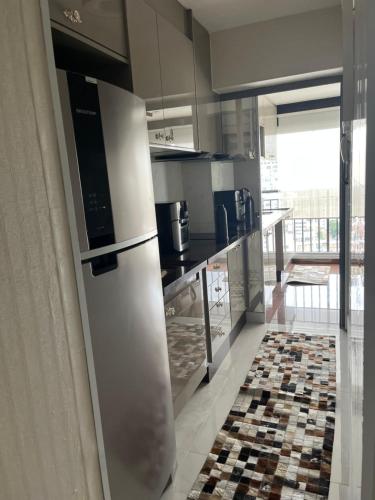 Kuchyň nebo kuchyňský kout v ubytování Flat sensacional 5 pessoas em condomínio moderno 2 suites climatizados
