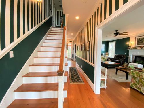 a staircase in a home with green walls at Marsa's Place in Edisto Island