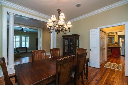 a dining room with a table and chairs at Misty Lane in Edisto Island