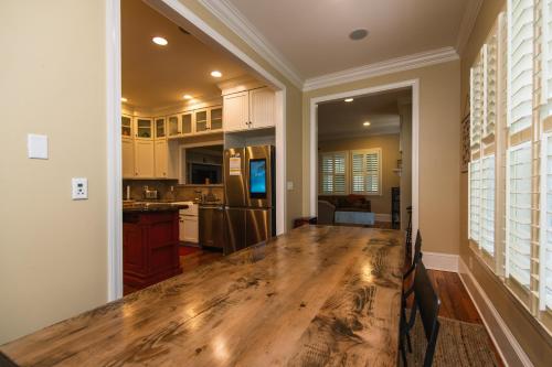 a kitchen with a wooden table in a room at Misty Lane in Edisto Island