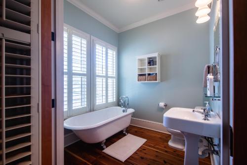 a bathroom with a tub and a sink at Misty Lane in Edisto Island
