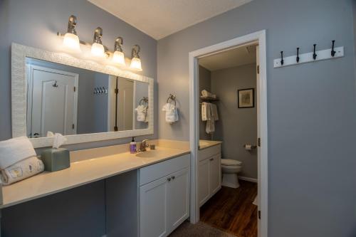 a bathroom with a sink and a mirror at 478 Egrets Pointe in Edisto Island