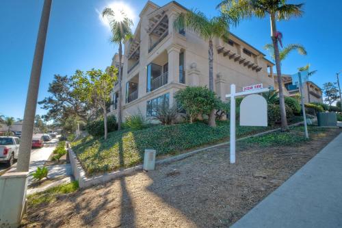 a large house with palm trees in front of it at 916 Sea Lane in Encinitas