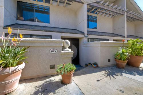 a building with potted plants in front of it at 916 Sea Lane in Encinitas