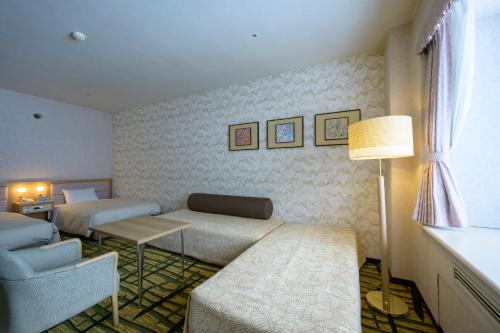 Cama o camas de una habitación en Hotel Tangram