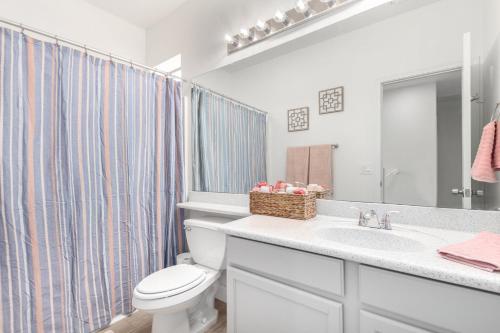 a bathroom with a white toilet and a sink at San Michelle Luxury Escape Mesa Pr1348 in Mesa