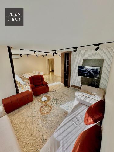 Televisyen dan/atau pusat hiburan di Alshemy Serviced Apartments