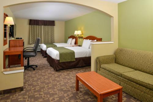 A bed or beds in a room at Americas Best Value Inn and Suites Little Rock