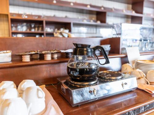 a coffee pot sitting on top of a counter at Century Plaza Hotel in Tokushima