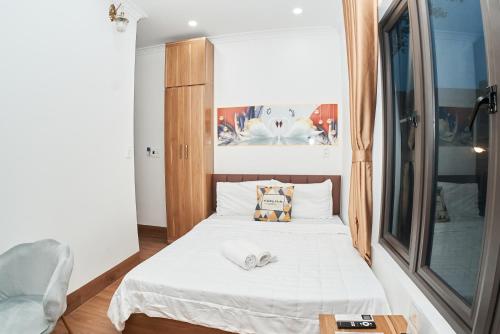 Postel nebo postele na pokoji v ubytování CiCi Hotel Hải Phòng
