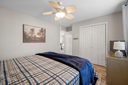 a bedroom with a bed and a ceiling fan at High Rock Haven in Lexington