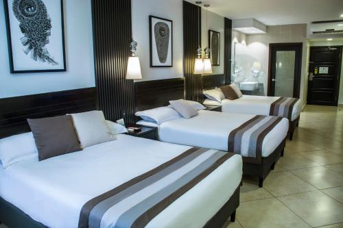 Voodi või voodid majutusasutuse Hotel Las Cascadas toas
