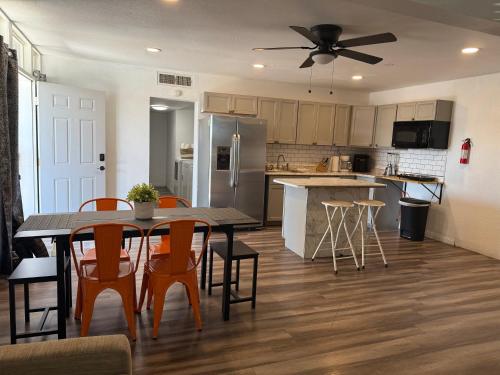 a kitchen and dining room with a table and chairs at Vegas Super Central 2 Min to LV Strip in Las Vegas