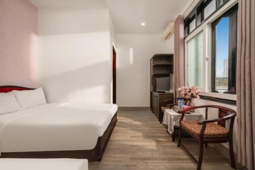 Ένα ή περισσότερα κρεβάτια σε δωμάτιο στο KLY Hotel
