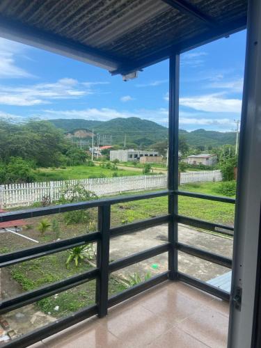 a view from the balcony of a house at Hostería del Puerto in Puerto López