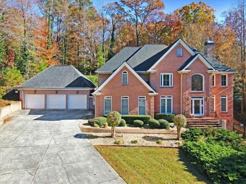 a large brick house with a garage at Star Mansion Atlanta in Atlanta