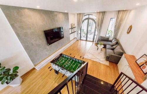 an aerial view of a living room with a table at Gấu House Villa in Da Lat