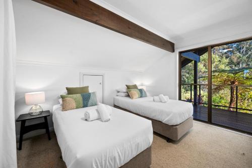 Ένα ή περισσότερα κρεβάτια σε δωμάτιο στο Cloud Valley Estate -Chalet