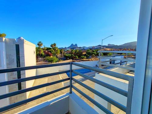 a view from the balcony of a apartment with blue railing at Condominio CB in San Carlos