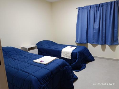 En eller flere senge i et værelse på Verde Mar